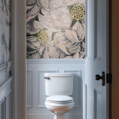 Botanical floral mosaic entryway wall featuring intricate lotus-inspired patterns in neutral tones with golden accents