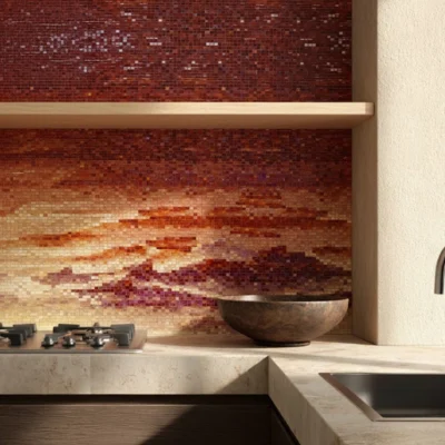 Amber and copper mosaic wall resembling a glowing sunrise, adding warmth and luxury to a modern kitchen interior.