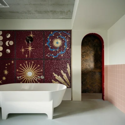 Mosaic mural with golden suns, lunar phases, and celestial motifs on a burgundy backdrop, adding cosmic elegance and drama to a luxury bathroom interior.