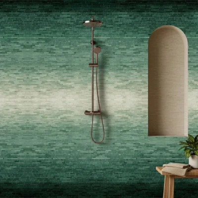 Soft green gradient mosaic wall transitioning from dark jade to pale mint, bringing natural harmony and calm to modern bathroom designs.