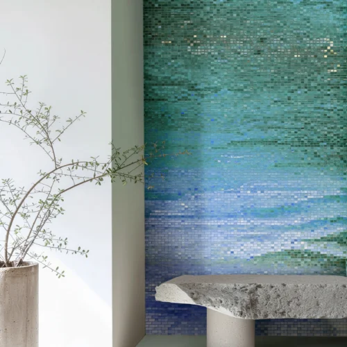 Gradient mosaic wall with aqua and blue tones reflecting soft ocean movement, ideal for bright modern bathrooms and living spaces.