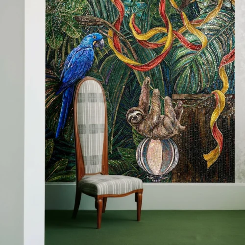 Rainforest mosaic mural with a blue parrot, monkey and sloth among tropical leaves and colorful ribbons, creating a bold wall feature in a room.