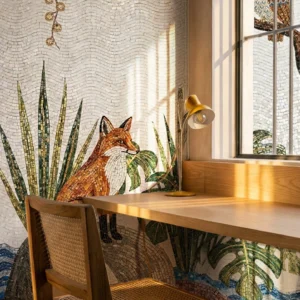Nature-inspired mosaic wall featuring a fox surrounded by green plants and wave patterns, styled with a wooden desk, chair, and warm sunlight.