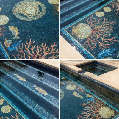 pool with Medusa mosaic, coral, fish and seashell patterns in deep blue tiles, plus spa, stone deck and lounge chairs.