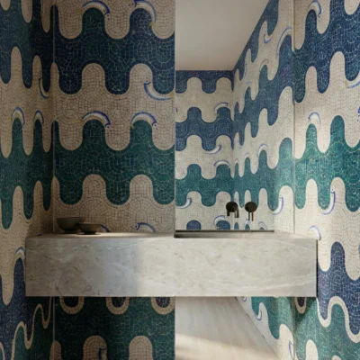Green, navy, and ivory wave pattern mosaic wall in a modern Mediterranean-style bathroom.