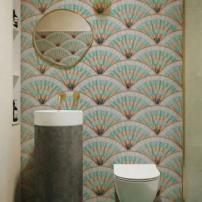 Art Deco fan pattern mosaic wall in mint green and terracotta tones in a modern bathroom.