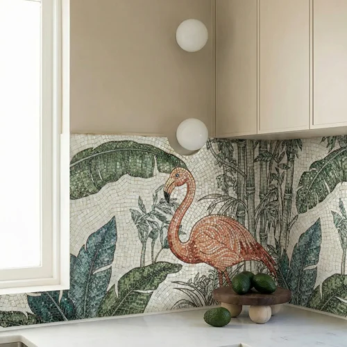 Flamingo mosaic kitchen backsplash with tropical leaves and palm details, paired with light cabinets and a stone countertop for a fresh design.