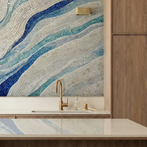Blue wave mosaic tile wall with flowing aqua and indigo patterns in a modern kitchen interior.