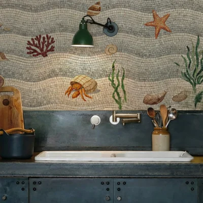 Marine life mosaic backsplash with seahorse, starfish, coral, and shells in a coastal-style kitchen.