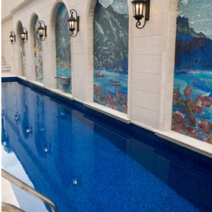 mosaic panels set within arched niches along a luxury outdoor pool.