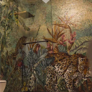 Leopard jungle mosaic mural with tropical foliage and soft sunlight effect in a luxury bathroom.