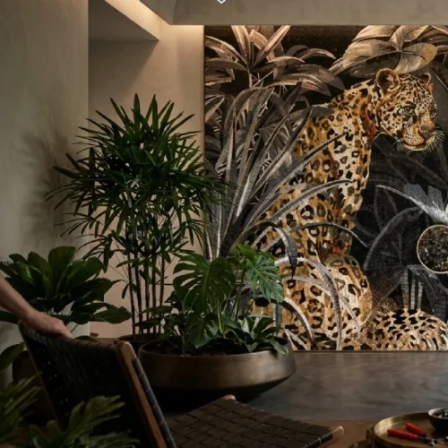Luxury jungle leopard mosaic mural surrounded by tropical foliage in a sophisticated living space.