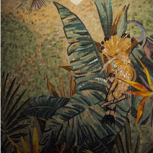 Bird of paradise mosaic mural with tropical foliage and a hummingbird in warm green and golden tones.