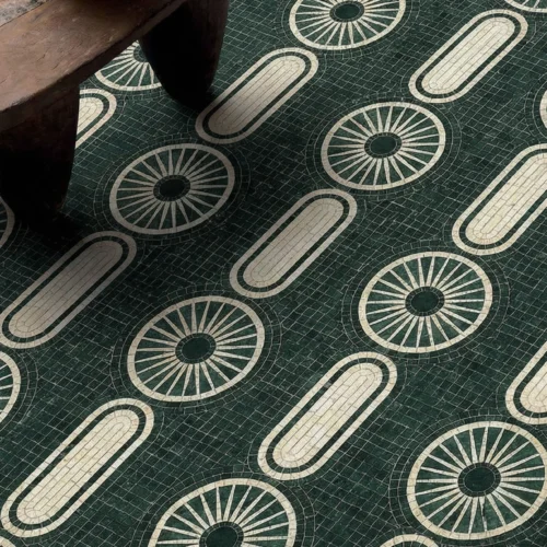 Emerald green mosaic floor with circular and oval geometric patterns in ivory tones.