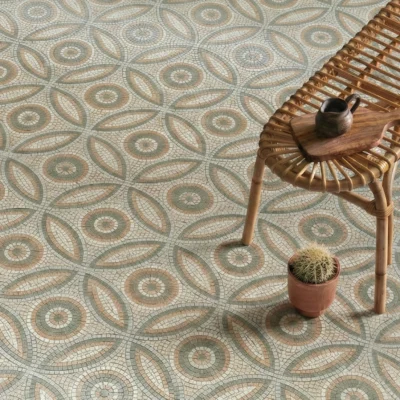 Mosaic floor with circular medallions and petal-shaped patterns in sage green, terracotta, and ivory tones.
