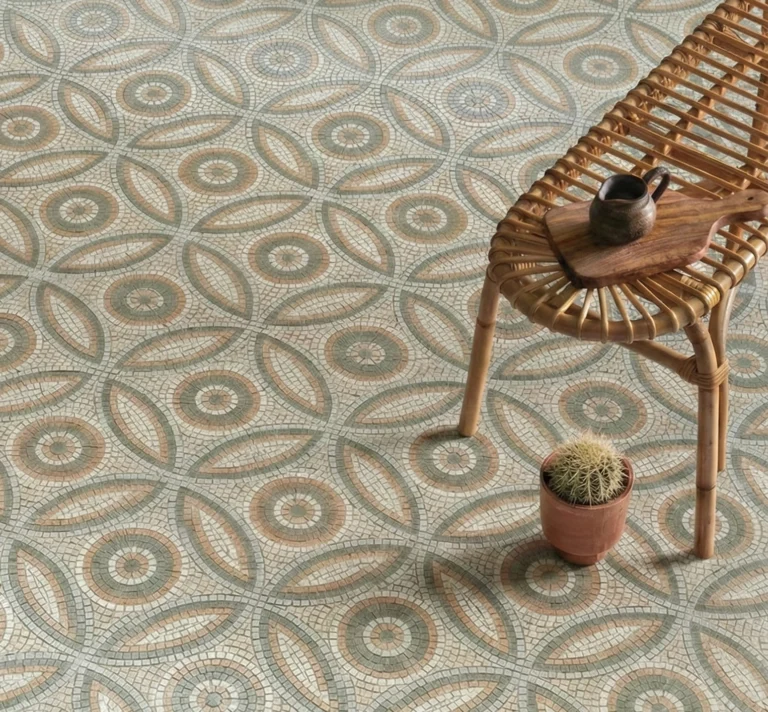 Mosaic floor with circular medallions and petal-shaped patterns in sage green, terracotta, and ivory tones.