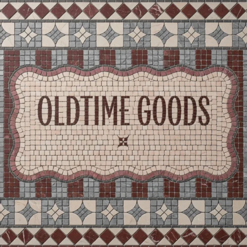 Vintage-style mosaic tile panel with “Old Time Goods” text and decorative geometric border.