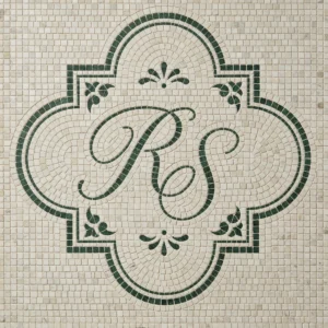 Monogram mosaic tile panel with green initials inside decorative cartouche on ivory background.