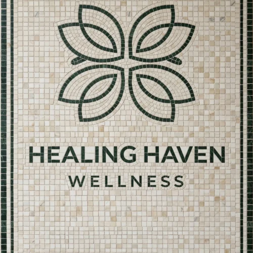 Mosaic tile panel with green lotus emblem and “Healing Haven Wellness” text on ivory background.