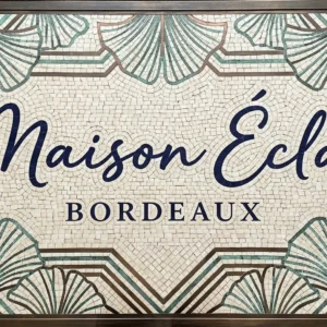 Custom mosaic panel with “Maison Éclat Bordeaux” text, ginkgo leaf patterns, and geometric border design.