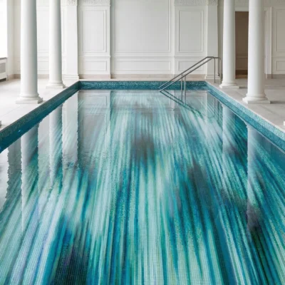 Abstract Modern Teal Stream pool mosaic in teal and aqua tones inside a luxury indoor pool space.