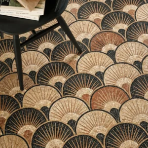 Art Deco mosaic floor with repeating fan-shaped arcs in beige, terracotta, and black tones.