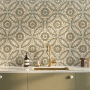 Mosaic tile with circular floral pattern and petal shapes in sage green, beige, and ivory tones.