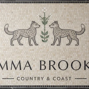 Mosaic tile panel with two leopards, floral motif, and “Emma Brooks Country & Coast” text.