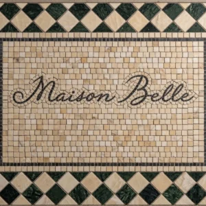 Mosaic tile panel with “Maison Belle” script, ivory background, and green diamond border pattern.