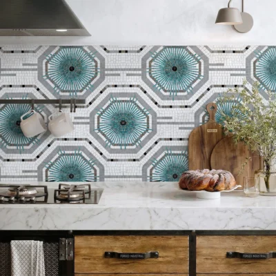 Geometric teal mosaic backsplash with radiant starburst patterns in aqua, grey, and white tones for modern luxury kitchens.
