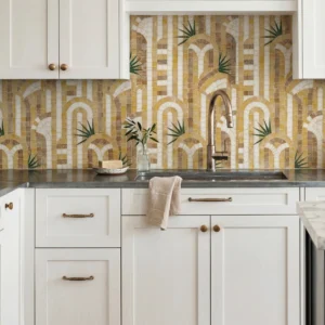 Luxury kitchen mosaic backsplash with geometric arch patterns in warm beige and gold tones accented by subtle green botanical details.