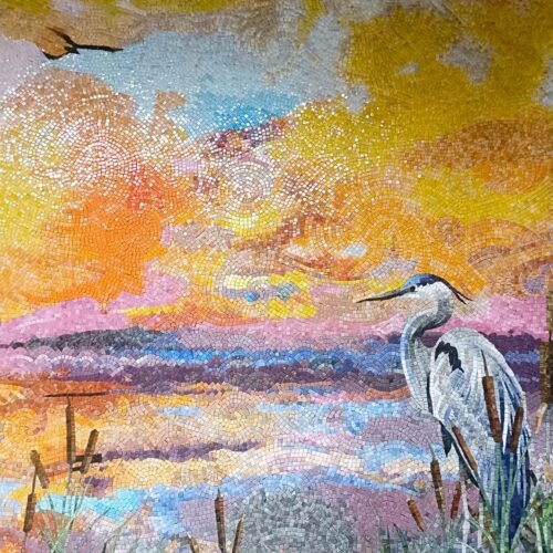 Handcrafted lakeside mosaic mural featuring a white heron, glowing sunset sky, pastel reflections, and swirling artistic textures.