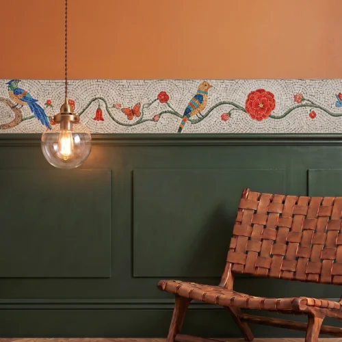 Handcrafted mosaic border featuring colorful birds, vines, flowers, and butterflies in a refined botanical-inspired interior.