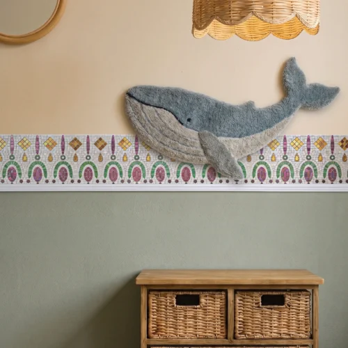 Colorful jewel-tone mosaic border with decorative arch motifs and geometric details installed as an artistic wall trim feature.