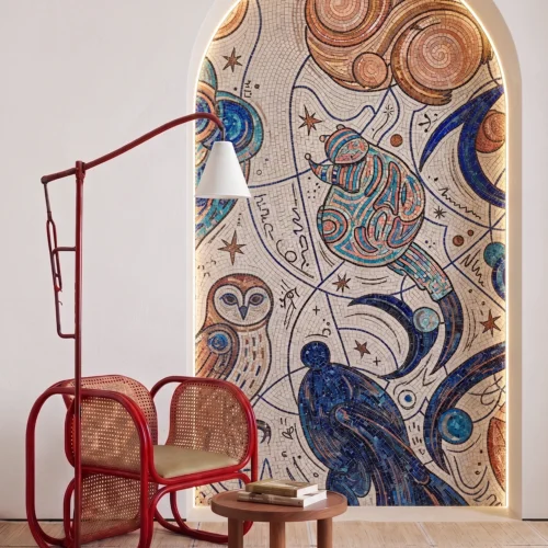 Handcrafted celestial mosaic featuring abstract cosmic motifs, stars, birds, and swirling blue patterns within an illuminated arched niche.