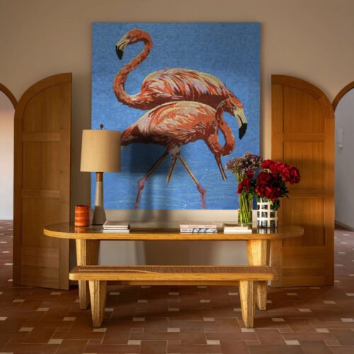 Handcrafted flamingo mosaic artwork featuring two elegant pink flamingos against a vivid blue textured mosaic background.