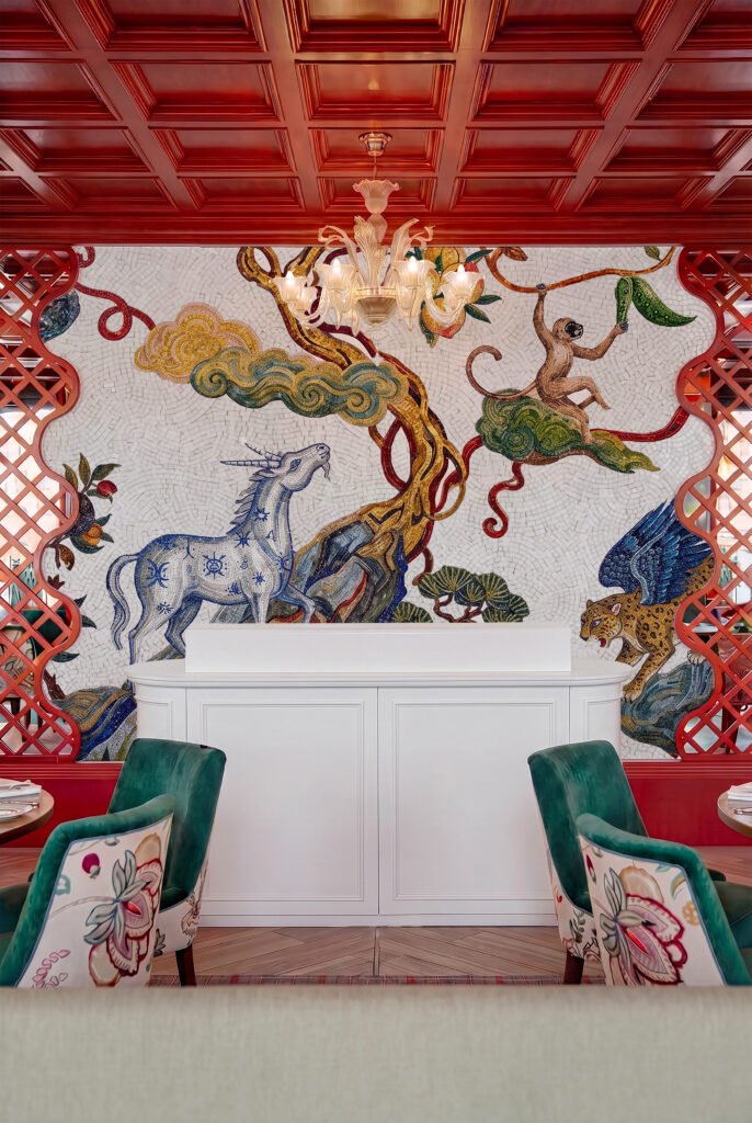 Custom mythical creature wall art in hand-laid stone for hospitality and commercial spaces