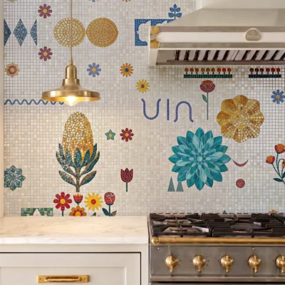 Handcrafted mosaic featuring colorful flowers, geometric motifs, and botanical elements in vibrant blue, gold, red, and green tones.