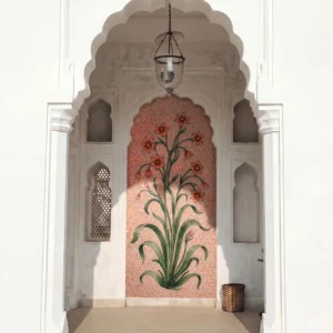 Handcrafted floral mosaic niche featuring blooming flowers and flowing green foliage on a soft pink background within a Mughal-style arch.