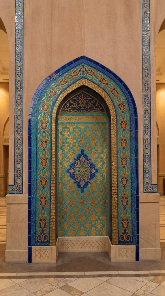 Handcrafted Islamic arch mosaic featuring intricate geometric patterns in cobalt blue, turquoise, gold, and ivory within a Moorish niche.