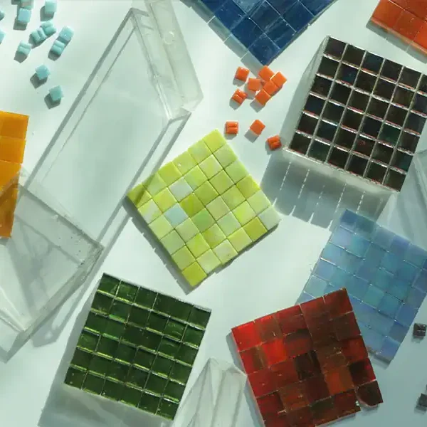 A multi color vibrant palette in square mosaics in red, blue, dark green and light green colors.