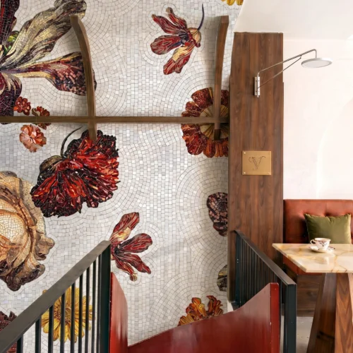 panoramic floral mosaic with oversized autumn blooms in warm earthy tones creating a dramatic luxury architectural feature wall.