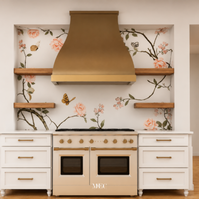 Handcrafted floral mosaic kitchen backsplash featuring blush roses, butterflies, and delicate branches behind a statement range hood.