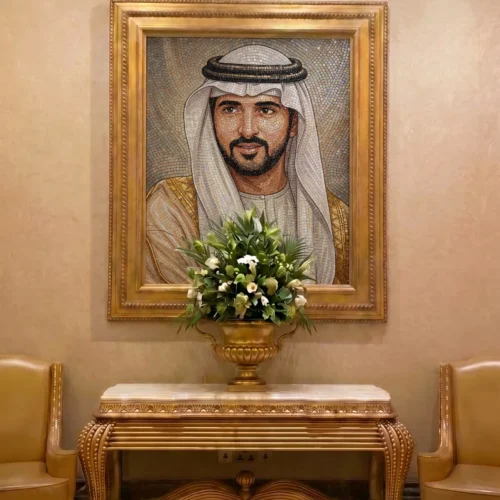 Handcrafted mosaic portrait of an Emirati leader featuring intricate facial detailing, traditional attire, and a luxurious gold-framed presentation.