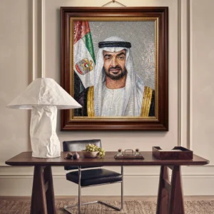 Handcrafted mosaic portrait of His Highness Sheikh Mohamed bin Zayed Al Nahyan with the UAE flag in a refined executive interior.