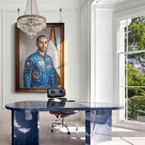 Handcrafted mosaic portrait of Major Hazzaa Al Mansoori in his astronaut suit with the UAE flag displayed in a contemporary executive office.