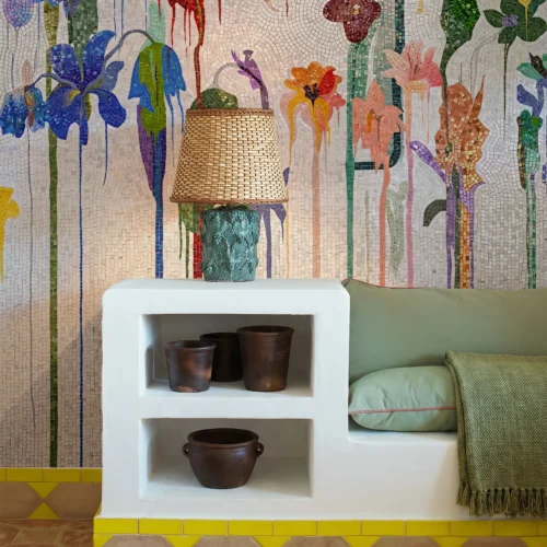 Handcrafted floral mosaic with colorful cascading flowers and elongated stems creating a vibrant botanical feature wall for luxury interiors.