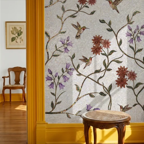 Handcrafted mosaic featuring hummingbirds, flowering vines, and botanical details on a luminous ivory background for elegant interior walls.