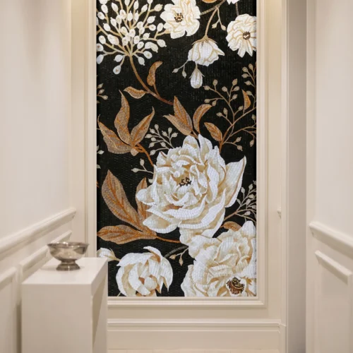 Handcrafted glass and marble floral mosaic mural featuring ivory blossoms and golden foliage on a black background for luxury interior feature walls.