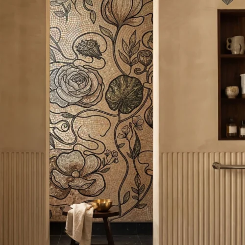 Handcrafted botanical mosaic bathroom wall featuring neutral flowers, leaves, vines, and intricate dark detailing.